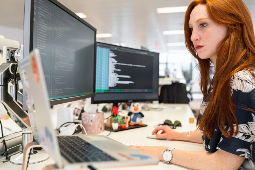 Woman Coding on Computer, custom web design and development